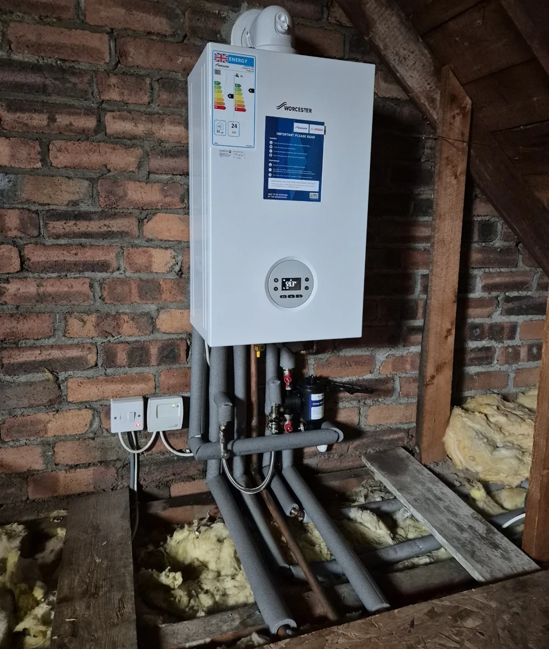 Worcester boiler installed in a loft with magnetic filter and insulated pipework